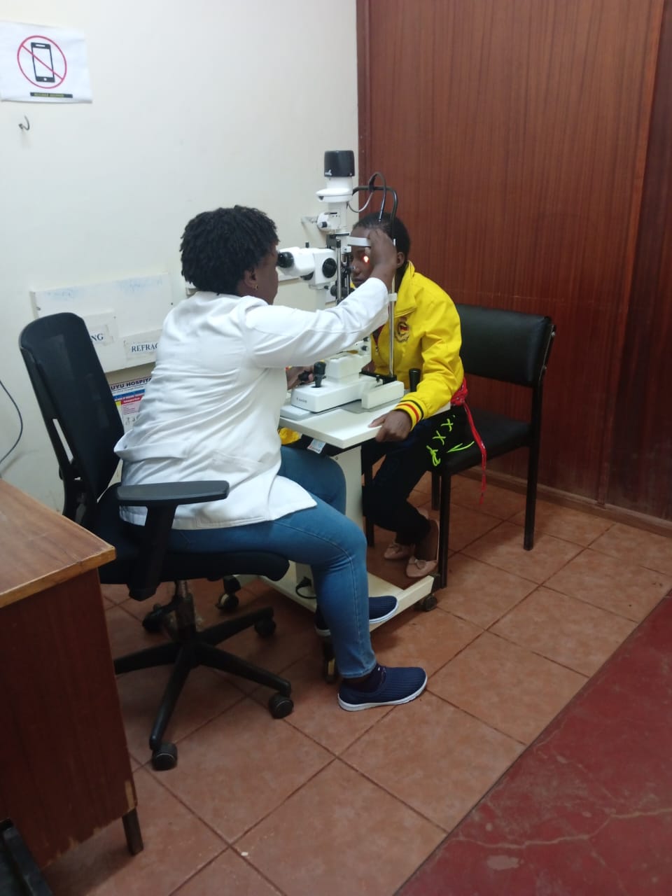 Taking one of the sponsored girls for eye check up.